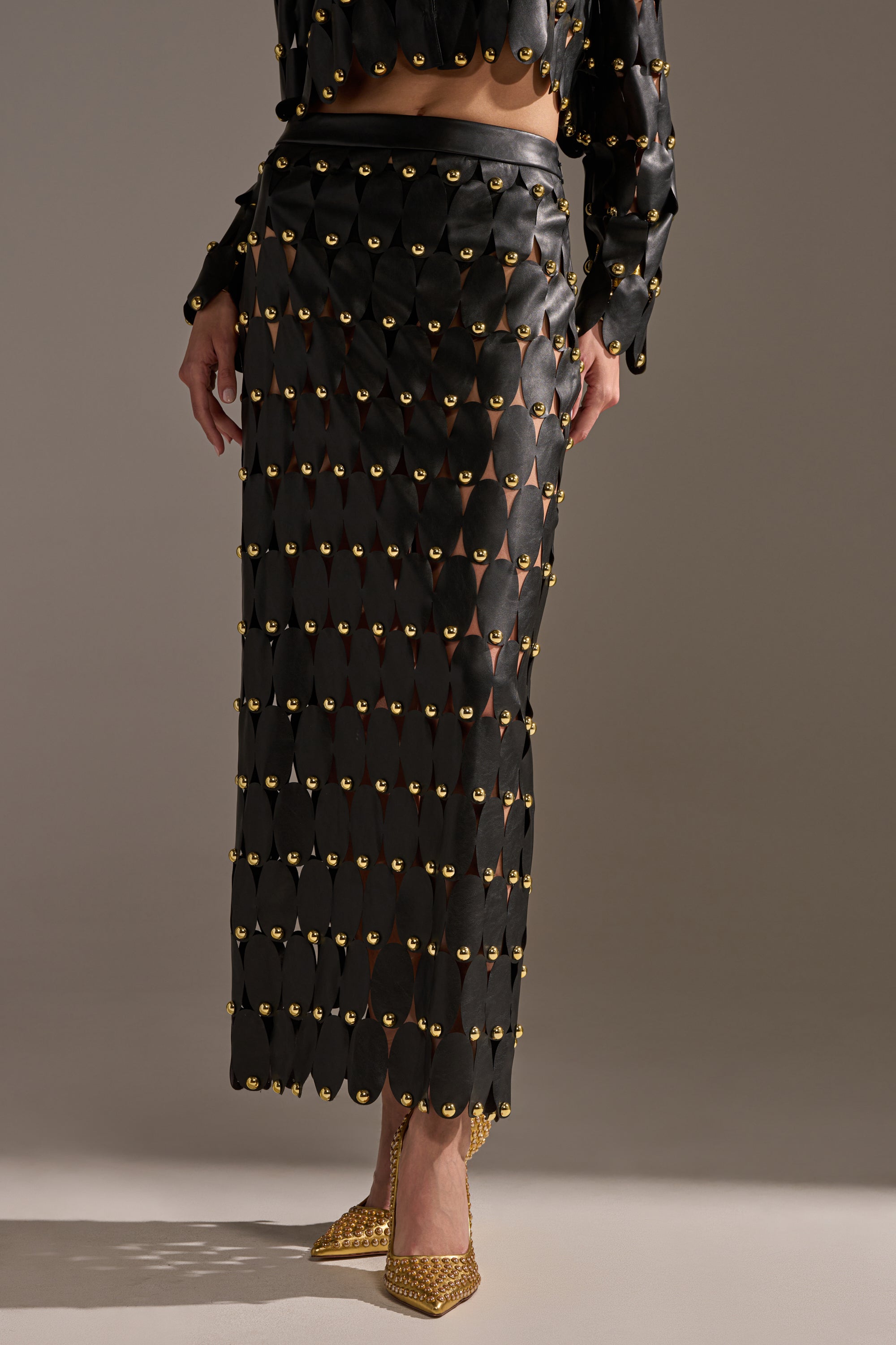 THE SNEAK PEEK STUDDED PU MIDI SKIRT IN BLACK