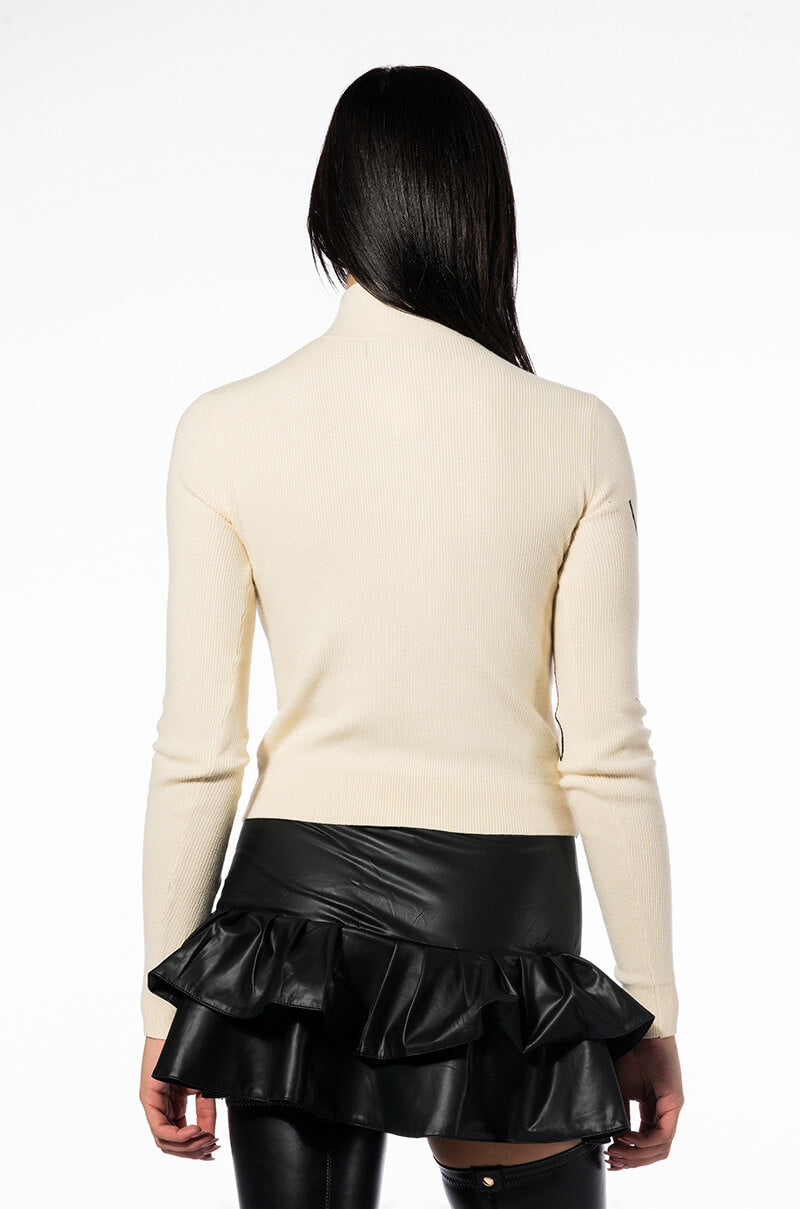 WILLA ABSTRACT FACE RIBBED TURTLENECK SWEATER