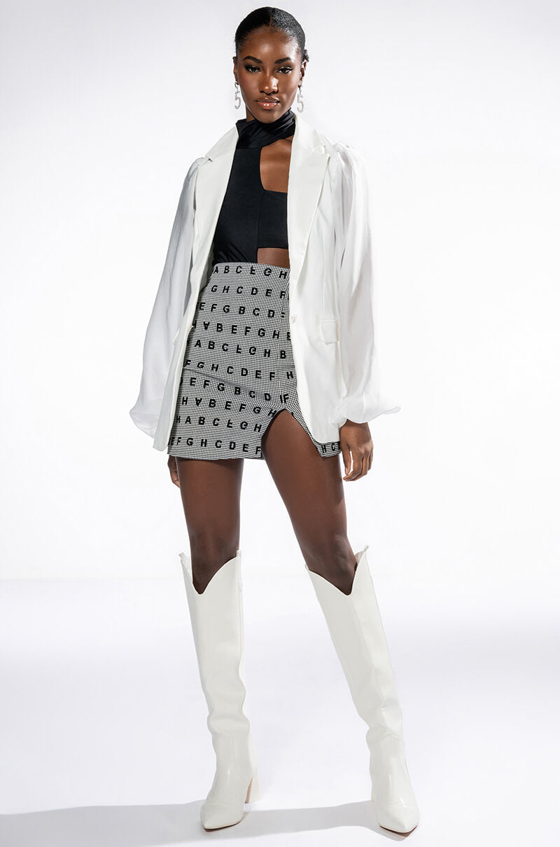 READ BETWEEN THE LINES HIGH RISE MINI SKIRT