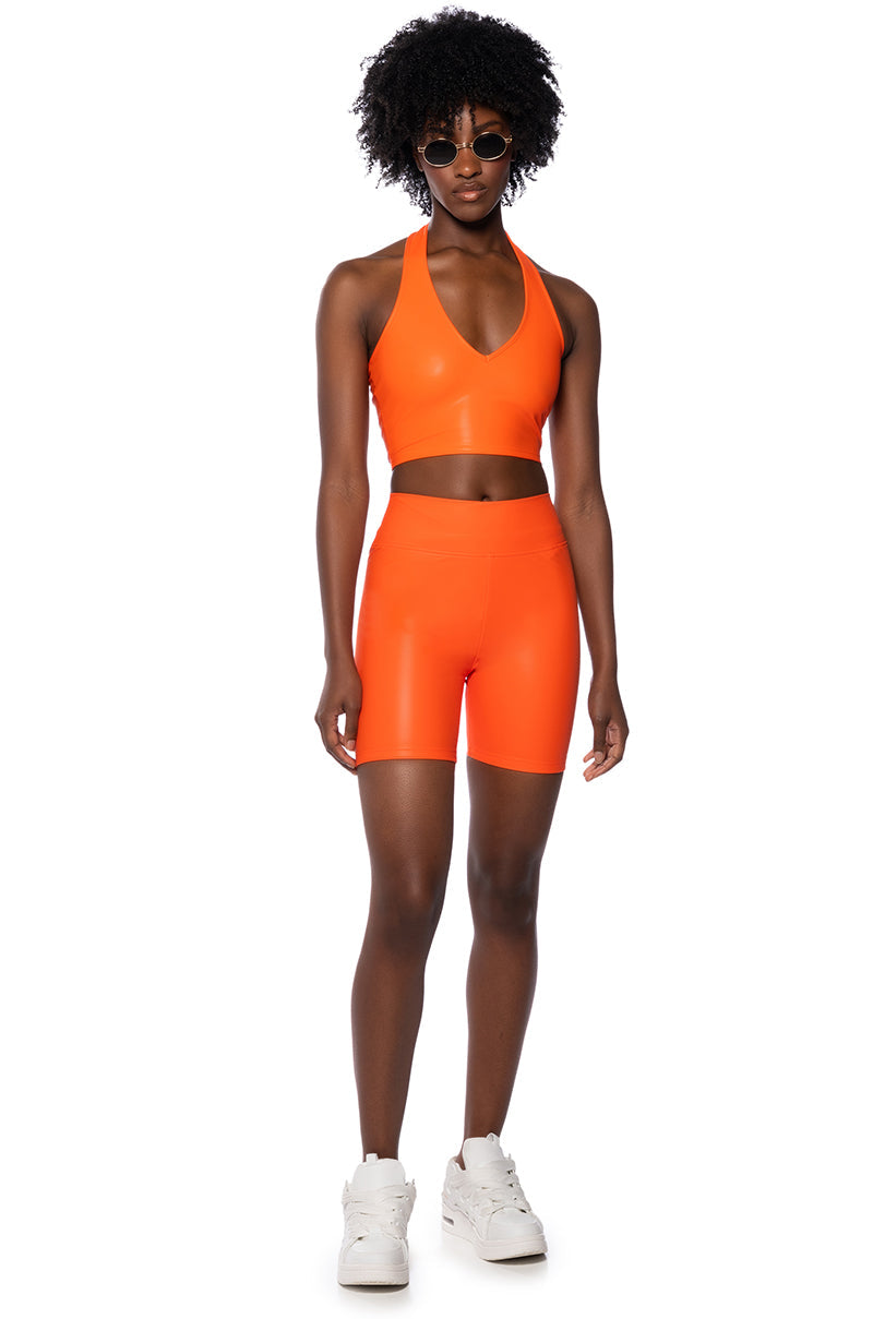 RIO FAUX LEATHER BIKER SHORT IN ORANGE